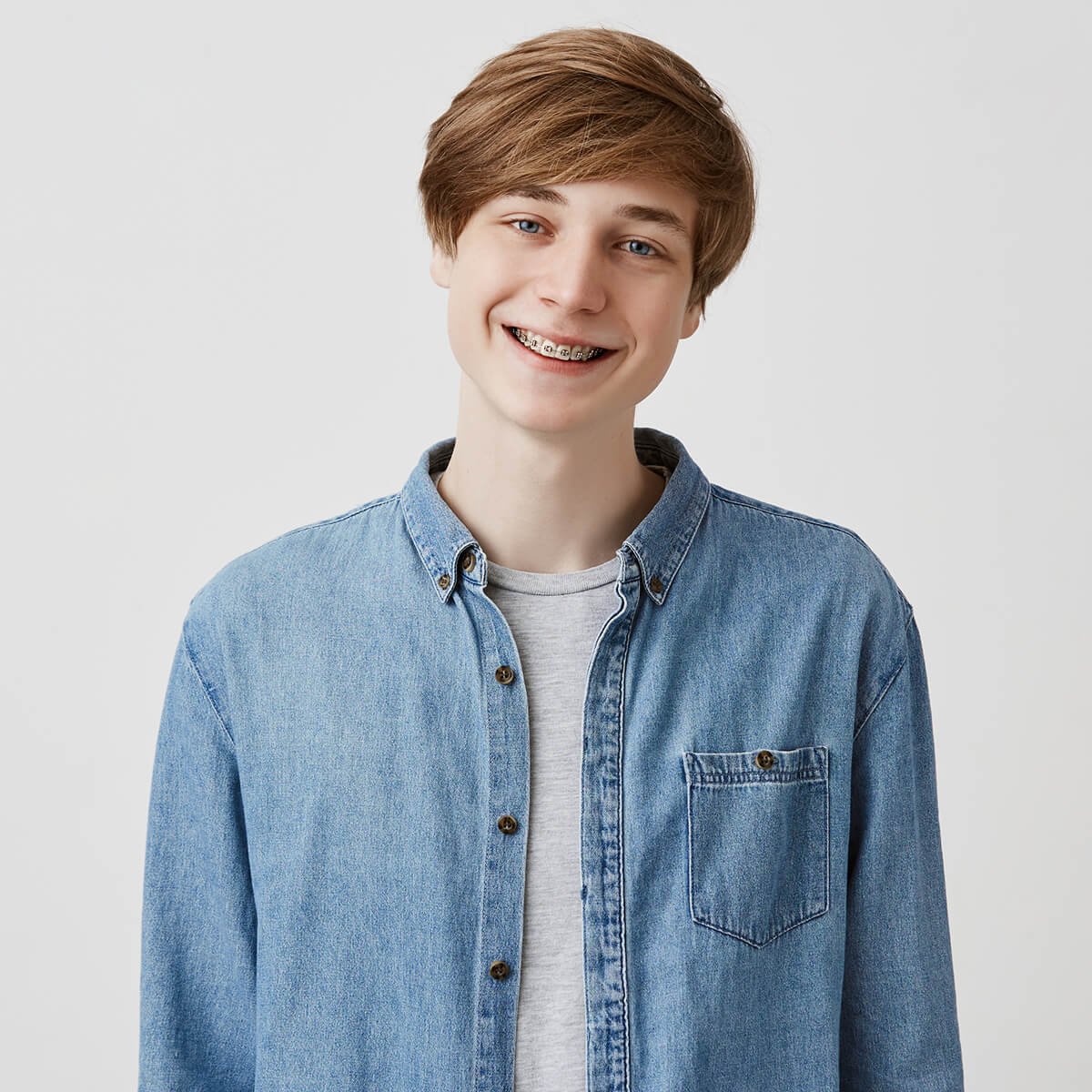 Happy young european man with fair hair and blue e