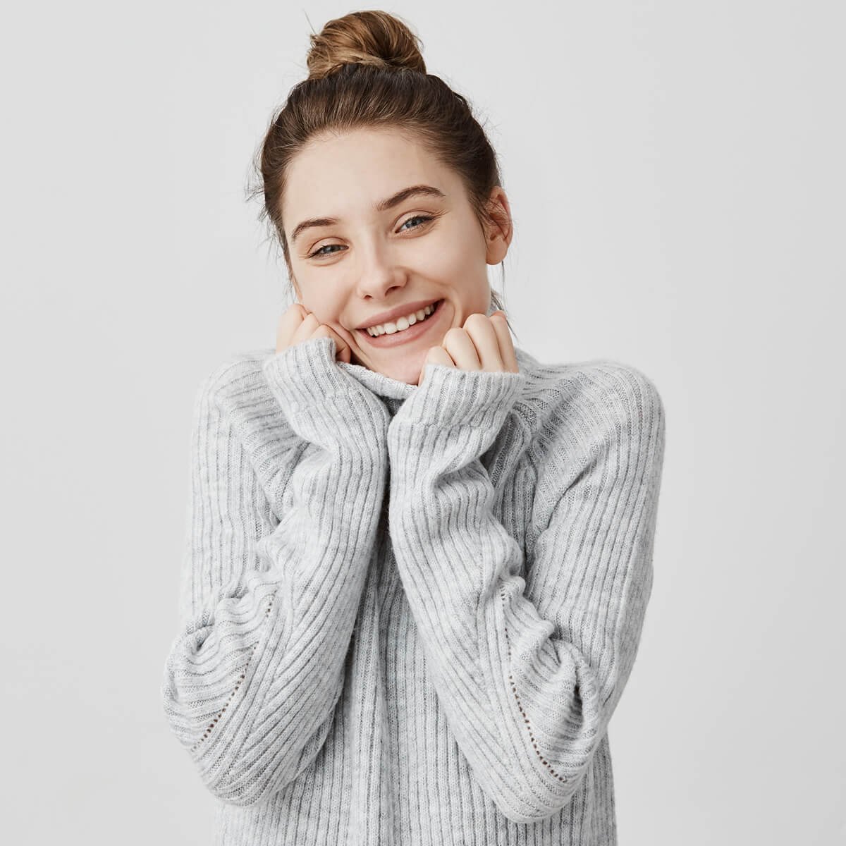 Headshot of adorable smiling woman wrapping up her